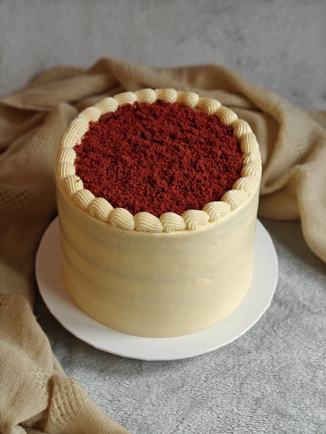 Classic red velvet cake with ivory cream cheese frosting